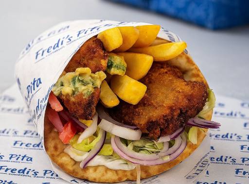 Our master chefs preparing souvlaki